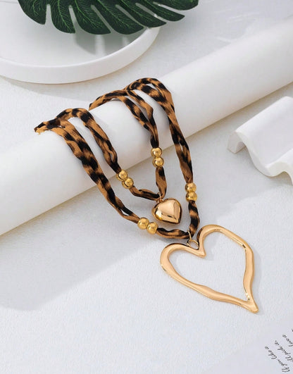 SHEIN 2pcs/Set Vintage Exaggerated Leopard Print Hollow Heart Pendant Necklace